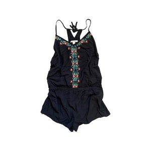 Black romper with floral embroidery